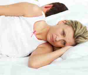 upset woman in bed with husband