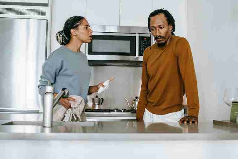 black couple having an argument in the kitchen