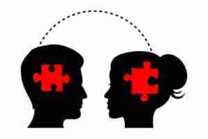 silhouette of male and female, each with puzzle piece on their head illustrating gender differences