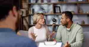 couple arguing during marriage counseling