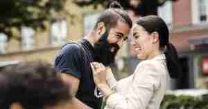laughing couple face to face
