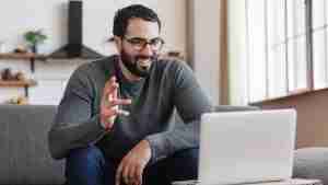 man working online with marriage coach or relationship coach