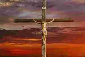Jesus Christ on cross at sunset