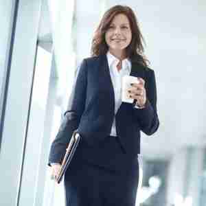 confident woman with coffee ready for a meeting