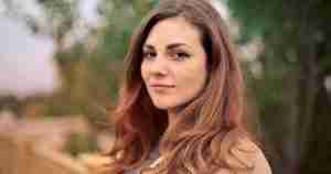 content woman outdoors Mona Lisa smile