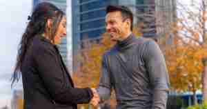 husband and wife shaking hands and smiling