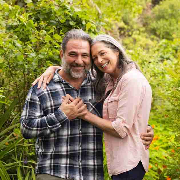 happy older couple embracing outdoors
