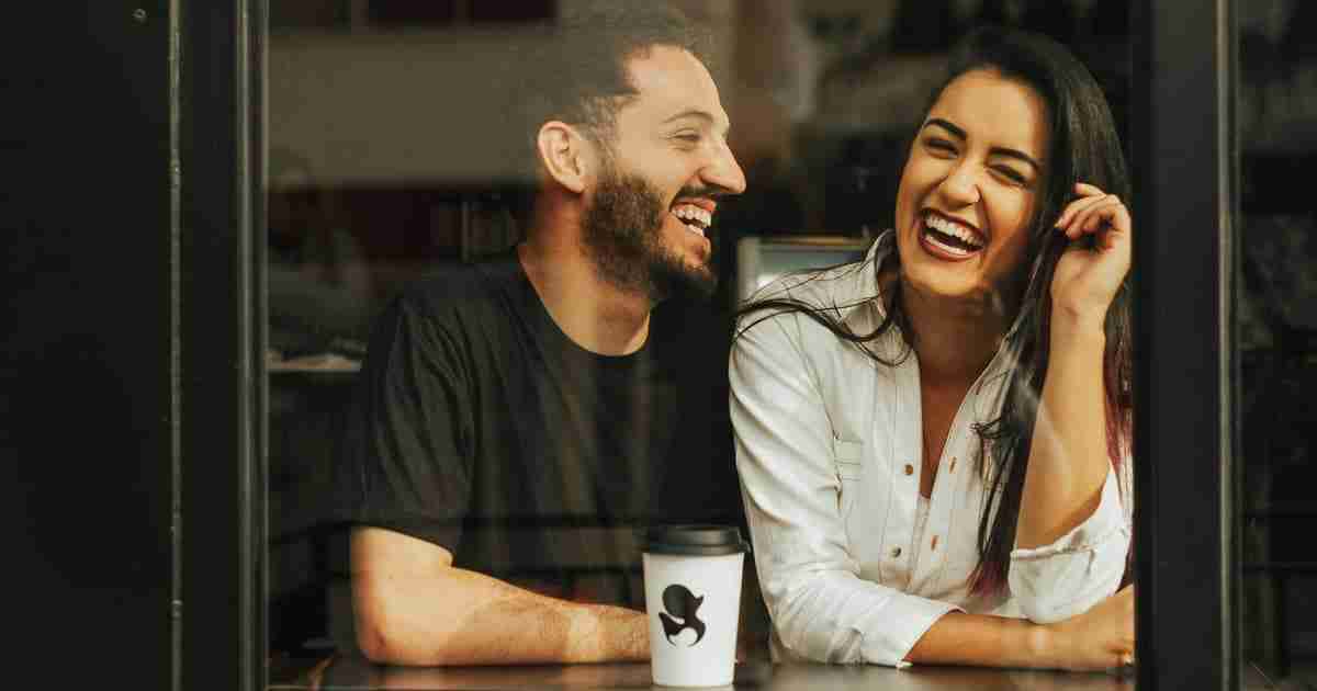 man and woman laughing together