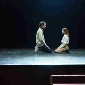 man and woman on stage