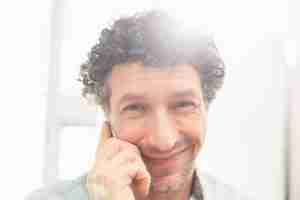 curly haired main smiling
