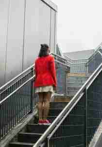 woman standing on steps going nowhere