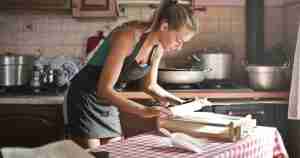 beautiful housewife cooking for her husband