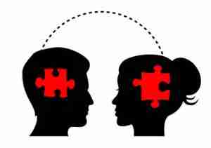 silhouettes of man and woman with puzzle pieces in their heads
