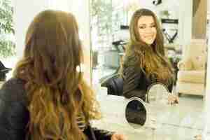 woman looking in a mirror