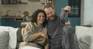 close couple sitting together on the sofa